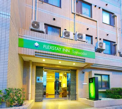 a building with a sign that reads flukyky inn tokyo at FLEXSTAY INN Tokiwadai in Tokyo