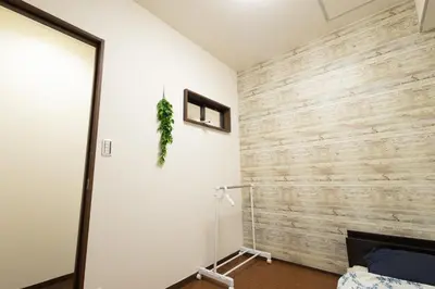 a room with a wooden wall at Comptoir Shinjuku - Vacation STAY 15325 in Tokyo