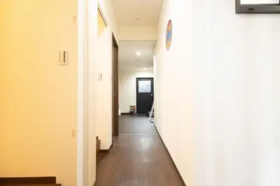 a hallway of an office with a white wall at Comptoir Shinjuku - Vacation STAY 15325 in Tokyo