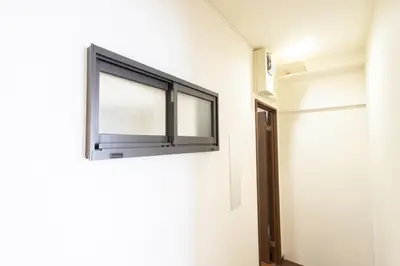 a window on the side of a wall in a room at Comptoir Shinjuku - Vacation STAY 15325 in Tokyo