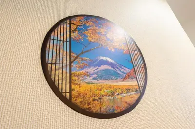 a round window with a picture of a mountain at Comptoir Shinjuku - Vacation STAY 15325 in Tokyo