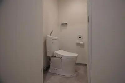 a bathroom with a white toilet in a room at MARUKOU HOTEL in Tokyo