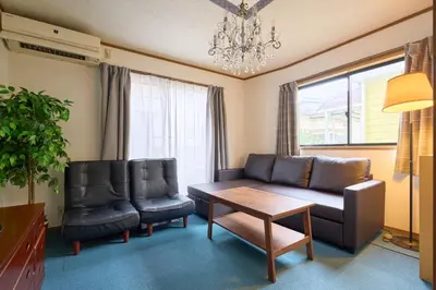 a living room with a couch and two chairs and a table at 9min to kitasenju sation 6min to shopping street quiet area in Tokyo