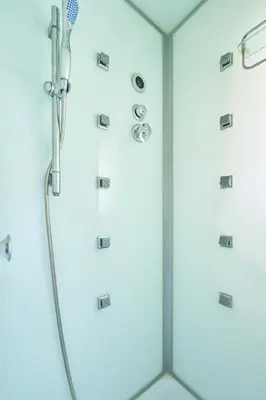 a shower with a glass door with a shower head at 9min to kitasenju sation 6min to shopping street quiet area in Tokyo
