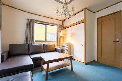 a living room with a couch and a table at 9min to kitasenju sation 6min to shopping street quiet area in Tokyo