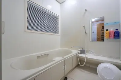 a bathroom with a tub and a sink and a toilet at Total 107square meter 4min to nearest staion Max16pp in Tokyo