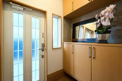 a kitchen with a vase of flowers on a cabinet at Total 107square meter 4min to nearest staion Max16pp in Tokyo