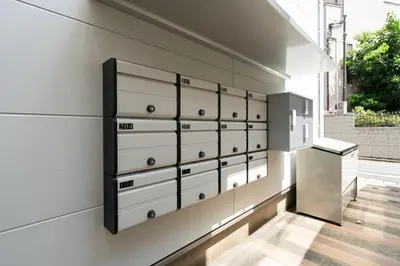 a wall of drawers in a room with a window at Verde\u6c60\u888b in Tokyo