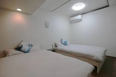 a room with two beds in a room at NEW OPEN 4BR, 110\u33a1 Walk to Asakusa in Tokyo