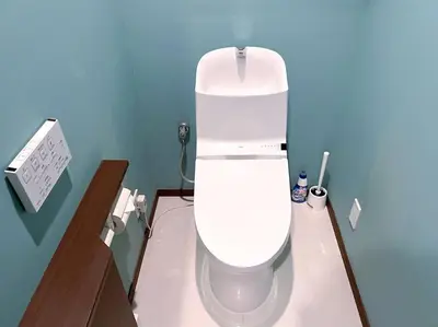 a bathroom with a white toilet in a blue wall at NEW OPEN 4BR, 110\u33a1 Walk to Asakusa in Tokyo