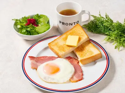 a plate of breakfast foods with a cup of coffee at APA Hotel Higashi Nihombashi Ekimae in Tokyo
