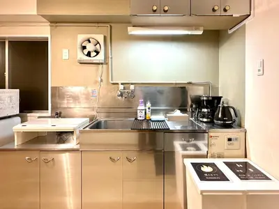 a kitchen with a sink and a counter top at 山手線池袋駅 徒歩6分 東池袋駅徒歩3分 2~5人 エレベーター WIFI 新宿/渋谷/銀座/築地/浅草/原宿近い！ in Tokyo