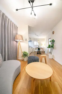 a living room with a couch and a table at Pufuka Kanegafuchi \u3077\u3075\u304b\u9418\u30f6\u6df5 in Tokyo