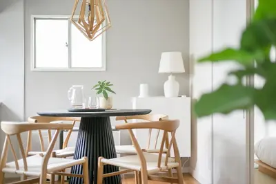 a dining room with a black table and chairs at Pufuka Kanegafuchi \u3077\u3075\u304b\u9418\u30f6\u6df5 in Tokyo