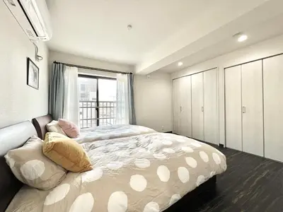 a bedroom with a large bed and a window at Sugamo-4F-TS0337 in Tokyo