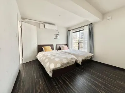 a bedroom with a bed and a large window at Sugamo-4F-TS0337 in Tokyo