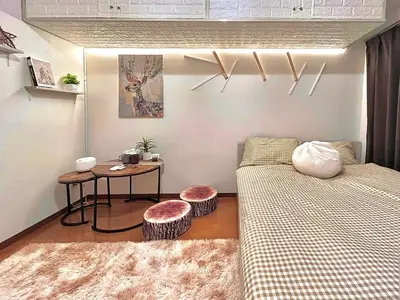 a small room with a bed and a table at Ikebukuro Sugamo 202 in Tokyo