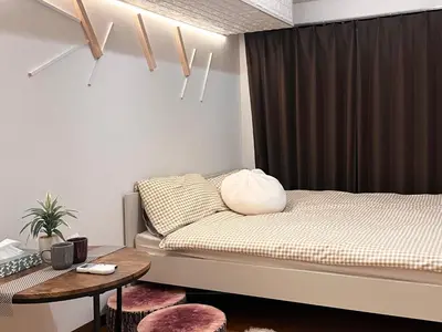 a small bedroom with a bed and a table at Ikebukuro Sugamo 202 in Tokyo