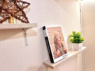a book sitting on a shelf next to a plant at Ikebukuro Sugamo 202 in Tokyo