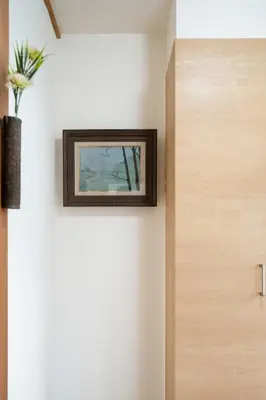 a picture hanging on a wall next to a door at hidden valley - Vacation STAY 40561v in Tokyo
