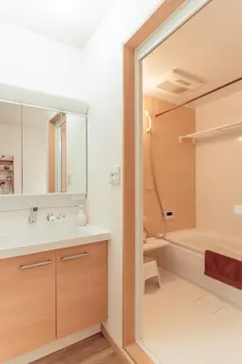 a bathroom with a tub and a sink and a mirror at hidden valley - Vacation STAY 40561v in Tokyo
