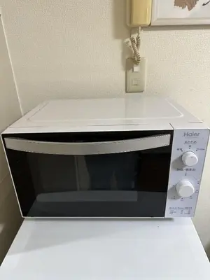 a microwave oven sitting on top of a counter at Wise Park Mukojima in Tokyo