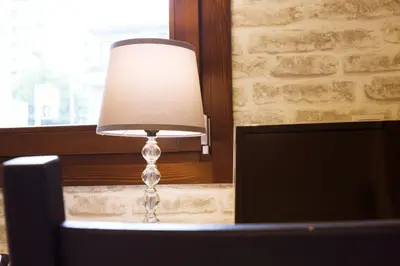 a lamp sitting on a table next to a computer at \u30aa\u30a6\u30eb\u30cf\u30a6\u30b9 in Tokyo