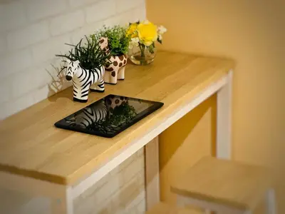 a table with a plate with a picture of a zebra at Hotel COMACHI in Tokyo