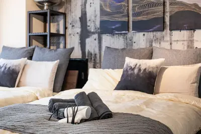 a bedroom with two large beds with pillows at \u30ea\u30ce\u30b9\u30bf\u30a4\u30eb\u62bc\u4e0a in Tokyo