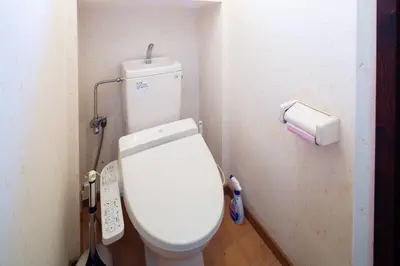 a bathroom with a white toilet in a stall at \u8981\u753a \u4e00\u6238\u5efa\u8cb8\u5bb6 in Tokyo