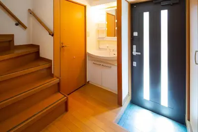 a bathroom with a sink and a toilet and stairs at \u8981\u753a \u4e00\u6238\u5efa\u8cb8\u5bb6 in Tokyo