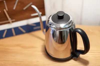a metal coffee pot sitting on top of a table at \u30d1\u30eb\u30b3\u30fc\u30c8\u6c60\u888b in Tokyo