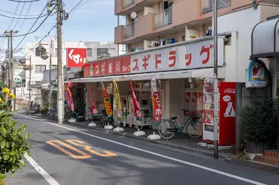 a street with a store on the side of the road at \u30d1\u30eb\u30b3\u30fc\u30c8\u6c60\u888b in Tokyo