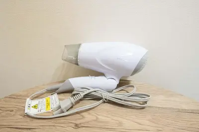 a hair dryer sitting on top of a table at \u30d1\u30f3\u30b7\u30aa\u30f3\u62bc\u4e0a in Tokyo