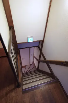 a set of stairs with a box on top of it at \u6e0b\u8c37\u672c\u753a4\u4e01\u76ee\u6238\u5efa in Tokyo
