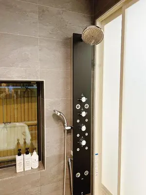 a bathroom with a shower with a bunch of wine bottles at Tokyo Private villa/near station/Ginza/Asakusa/Sky Tree/Louis House in Tokyo