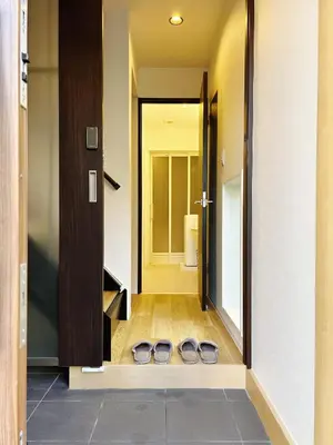 a pair of shoes on the floor in front of a door at Tokyo Private villa/near station/Ginza/Asakusa/Sky Tree/Louis House in Tokyo