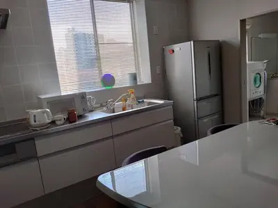 a kitchen with a sink and a refrigerator at \u773a\u3081\u306e\u3044\u3044\u4e00\u8ed2\u5bb6 in Tokyo