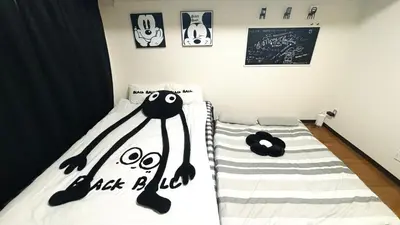 a bedroom with a bed with a ghost face on it at \u5de3\u9d28 \u6700\u59274\u4eba in Tokyo
