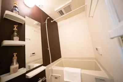 a small bathroom with a shower and a sink at shinjuku1 in Tokyo