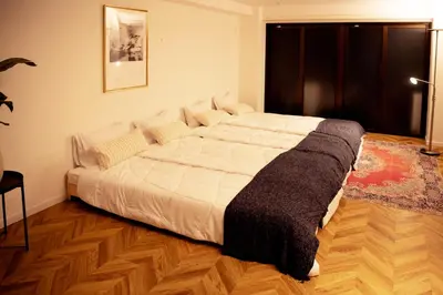 a bedroom with a large bed in a room at #4New open 3stops to Shinjuku spacious stylish apartment in Tokyo