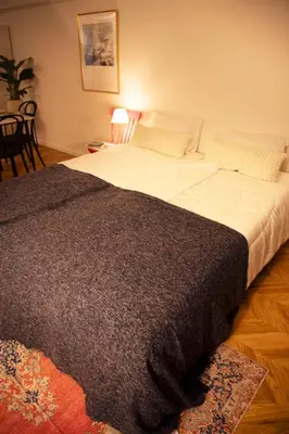 a large bed with a black blanket on it at #4New open 3stops to Shinjuku spacious stylish apartment in Tokyo