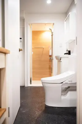a white bathroom with a toilet and a shower at #4New open 3stops to Shinjuku spacious stylish apartment in Tokyo