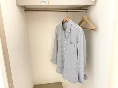 a shirt hanging on a rack in a room at COMMA HOUSE Nishi-ikebukuro 2223 in Tokyo