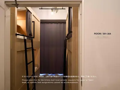 a mirror in a room with a curtain at Hotel Plus Hostel TOKYO ASAKUSA 1 in Tokyo
