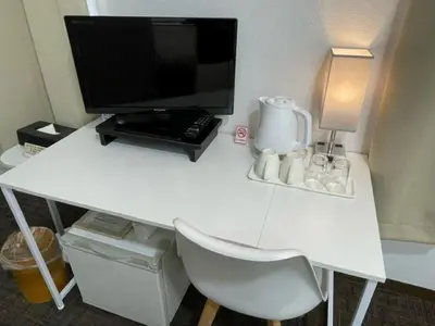 a white desk with a television on top of it at Hotel Royal Oak Gotanda in Tokyo