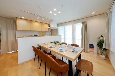 a kitchen and dining room with a table and chairs at Convertel Daita by Tranova in Tokyo