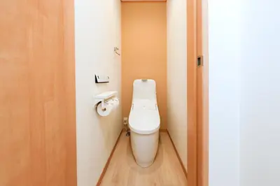 a bathroom with a toilet in a small room at Convertel Daita by Tranova in Tokyo