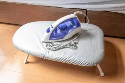 a blue and white iron sitting on a chair at 2023年8月オープン/入谷駅から徒歩10分/収容人数6/浅草寺徒歩10分/上野駅タクシー7分2km in Tokyo
