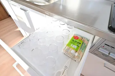 an open refrigerator filled with lots of dishes at Ueno Luxury 161m2 Villa 6BR 3Bath 4Toilet 3m to Train Skytree View in Tokyo